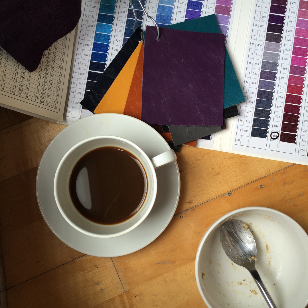 coffee cup with color swatches in designers studio