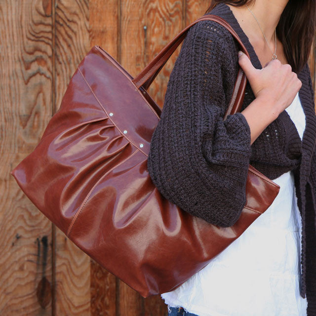 "the practical, fashionable, water-resistant troubadour tote" on Outblush.com