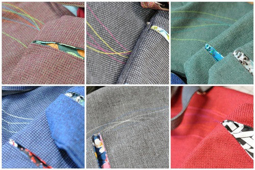 a rainbow of colorful tweed bags on their way
