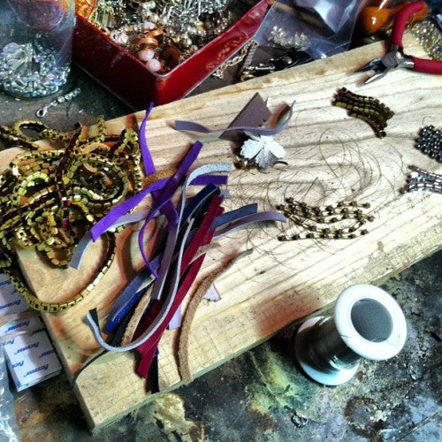 vintage rhinestones and reclaimed leather jewelry in the making