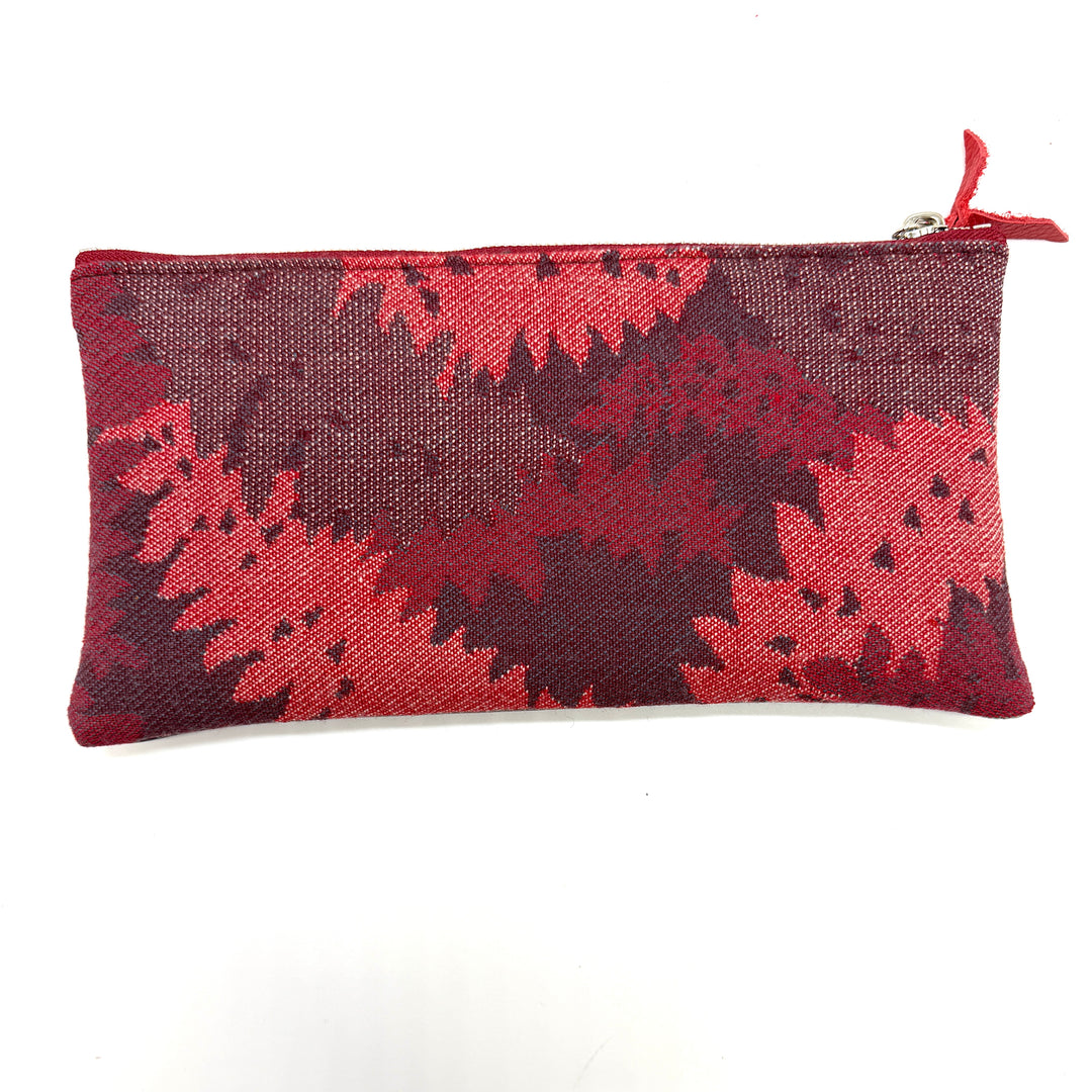 Red and brown patterned pouch on a white background#color_red-ferns