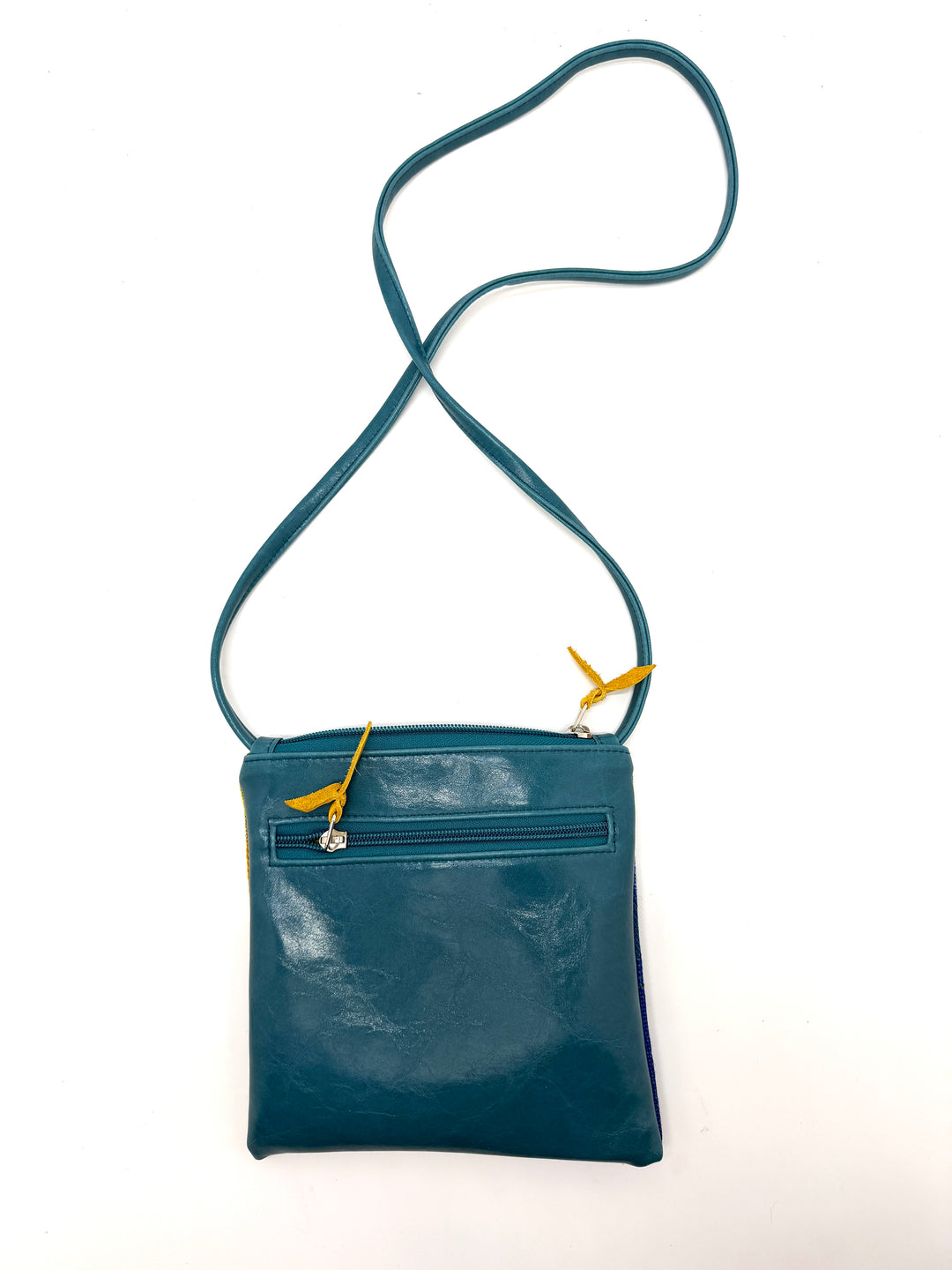 Blue crossbody bag with a strap on a white background#color_clouds-warm