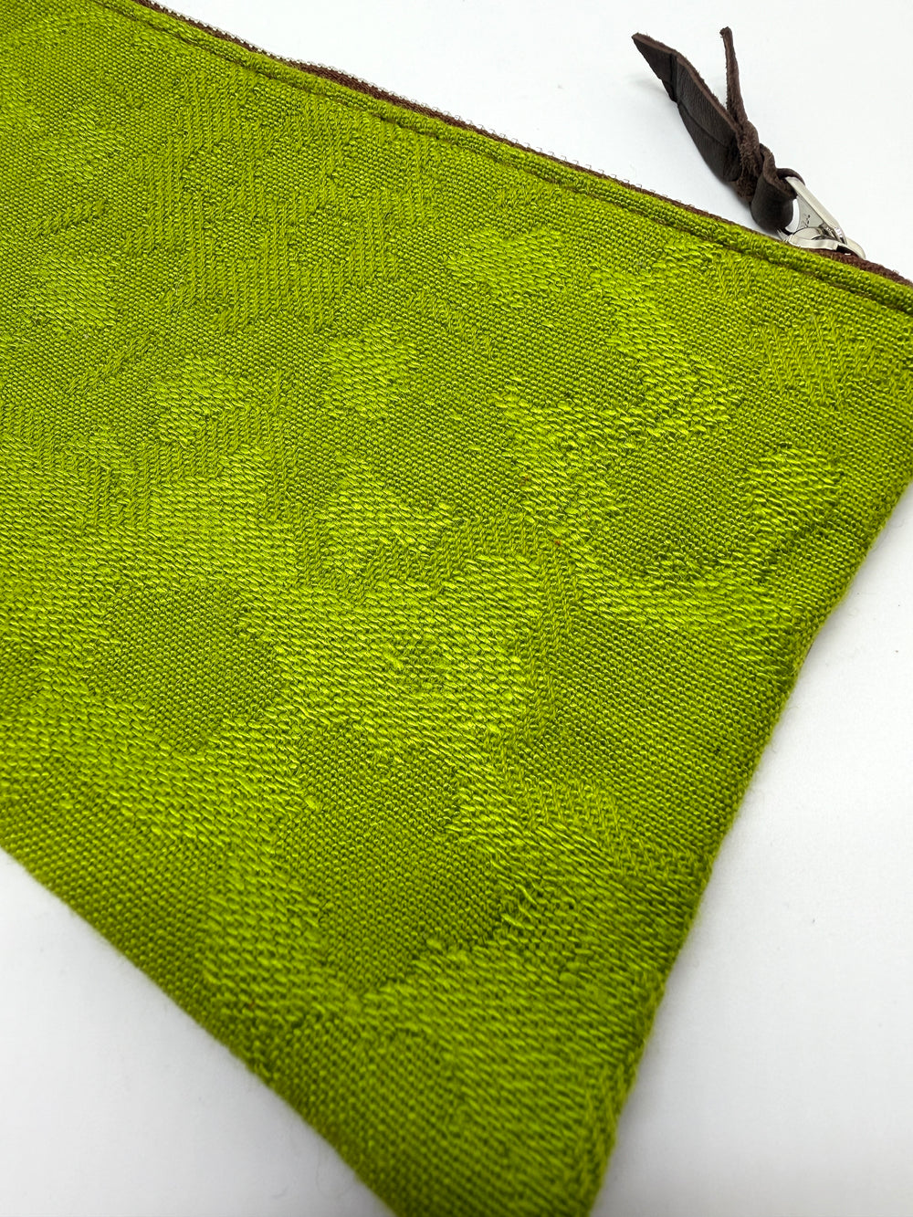 Green textured pouch with a zipper on a white background#color_aerolinas-argentinas-green