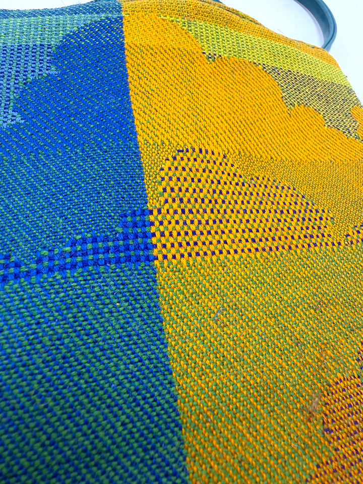 Close-up of blue and yellow woven fabric#color_clouds-warm
