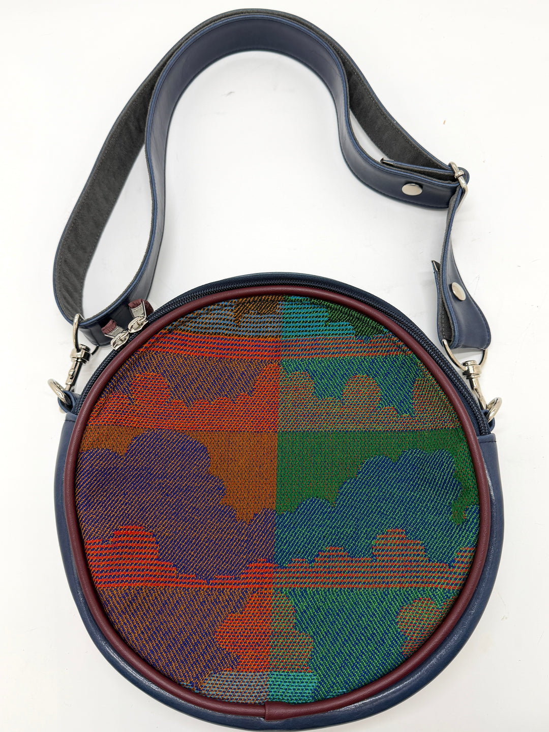 Round bag with a colorful patchwork pattern on a white background#color_navy-clouds-airplane-fabric