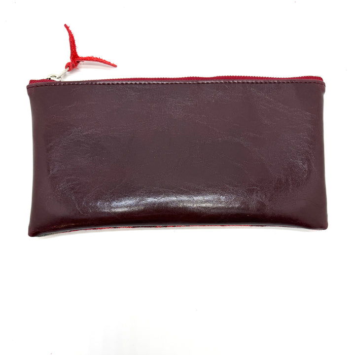 Brown leather pouch with a red zipper on a white background#color_red-ferns