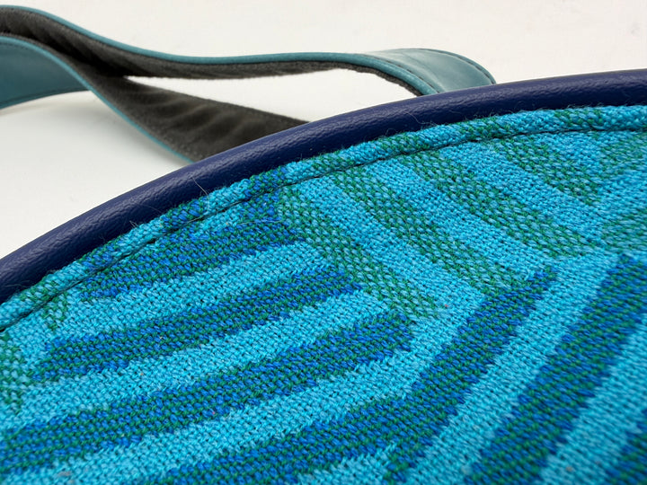 Close-up of a blue textured object with a white background#color_navy-teal-hexagon-airplane-fabric