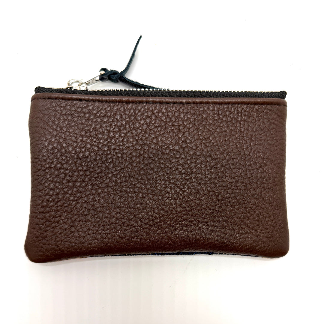 Brown leather pouch with a zipper on a white background