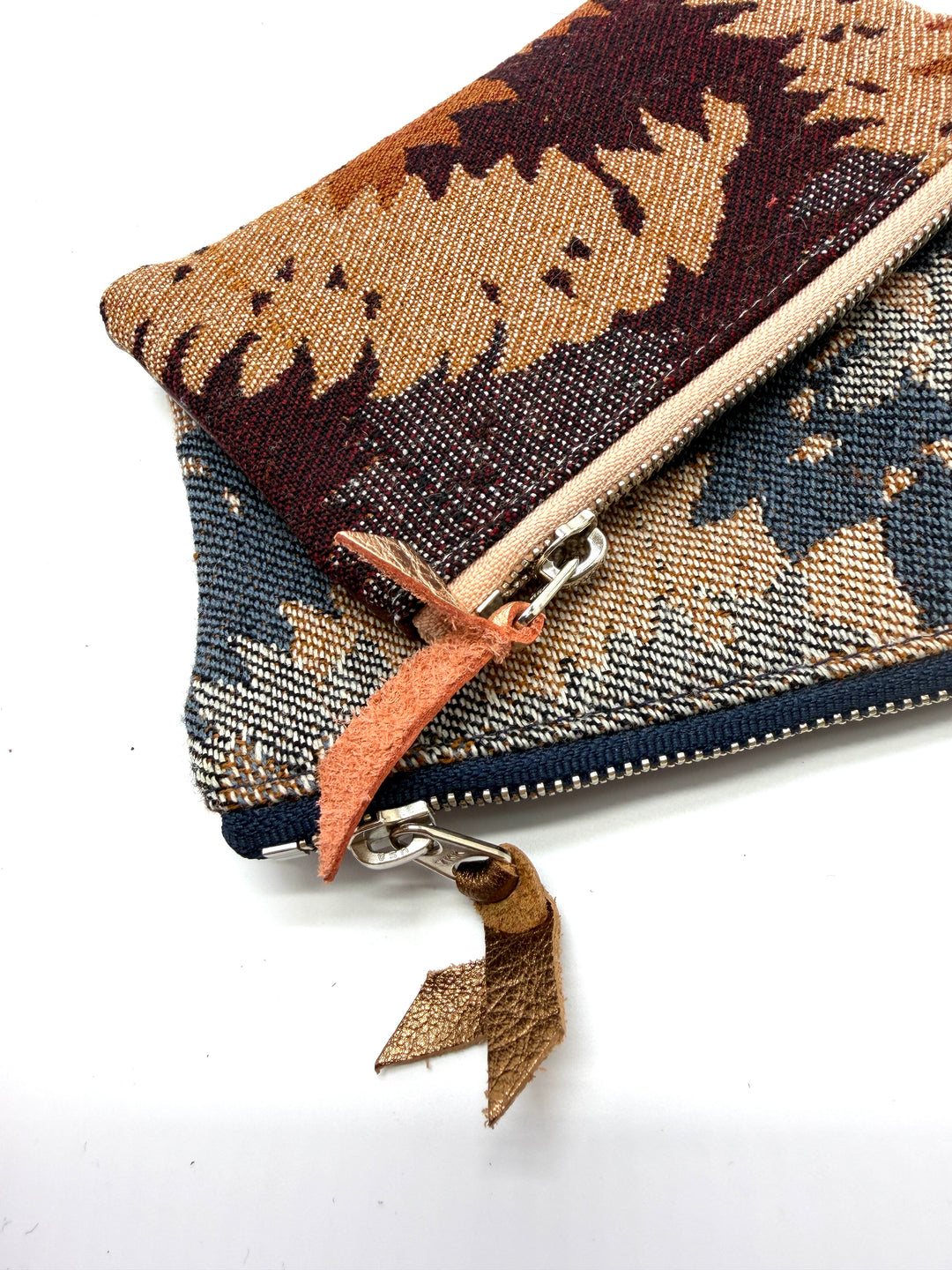 Woven pouch with a zipper on a white background#color_midnight-ferns