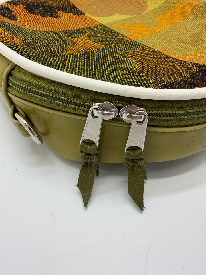 Camouflage-patterned pouch with zippers on a white background#color_citrine-clouds-airplane-fabric