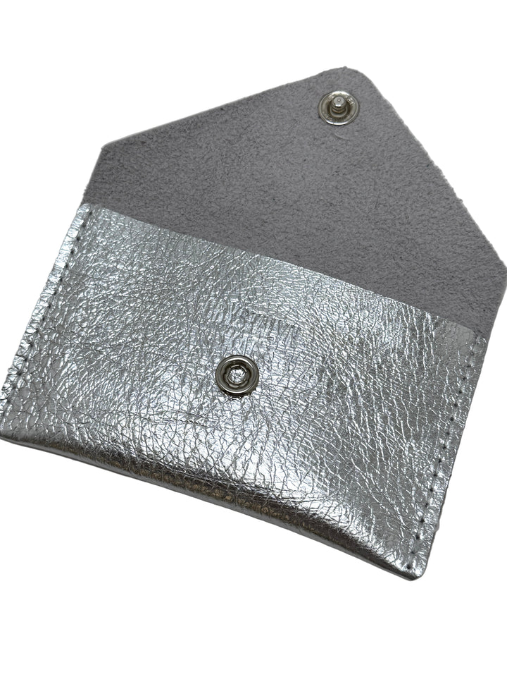 Silver leather wallet with gray flap on a gray background#color_silver