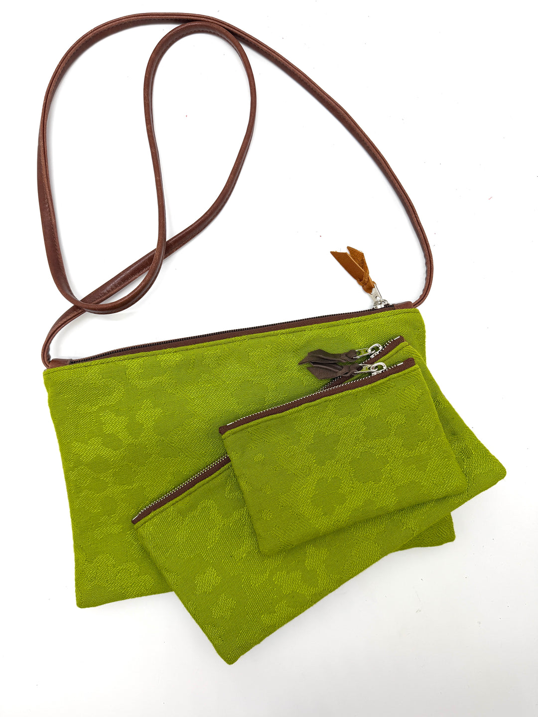 Green crossbody bag with a smaller pouch on a white background#color_aerolinas-argentinas-green