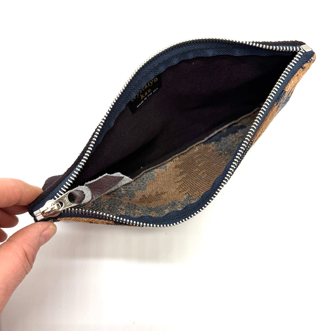 Open zipper pouch with floral pattern on a white background#color_midnight-ferns