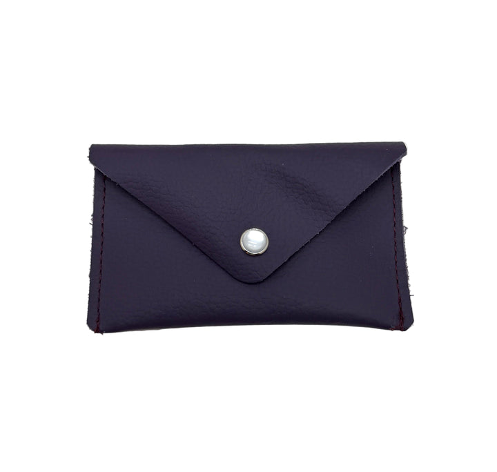 Purple blue cardholder with a silver button on a white background #color_plum