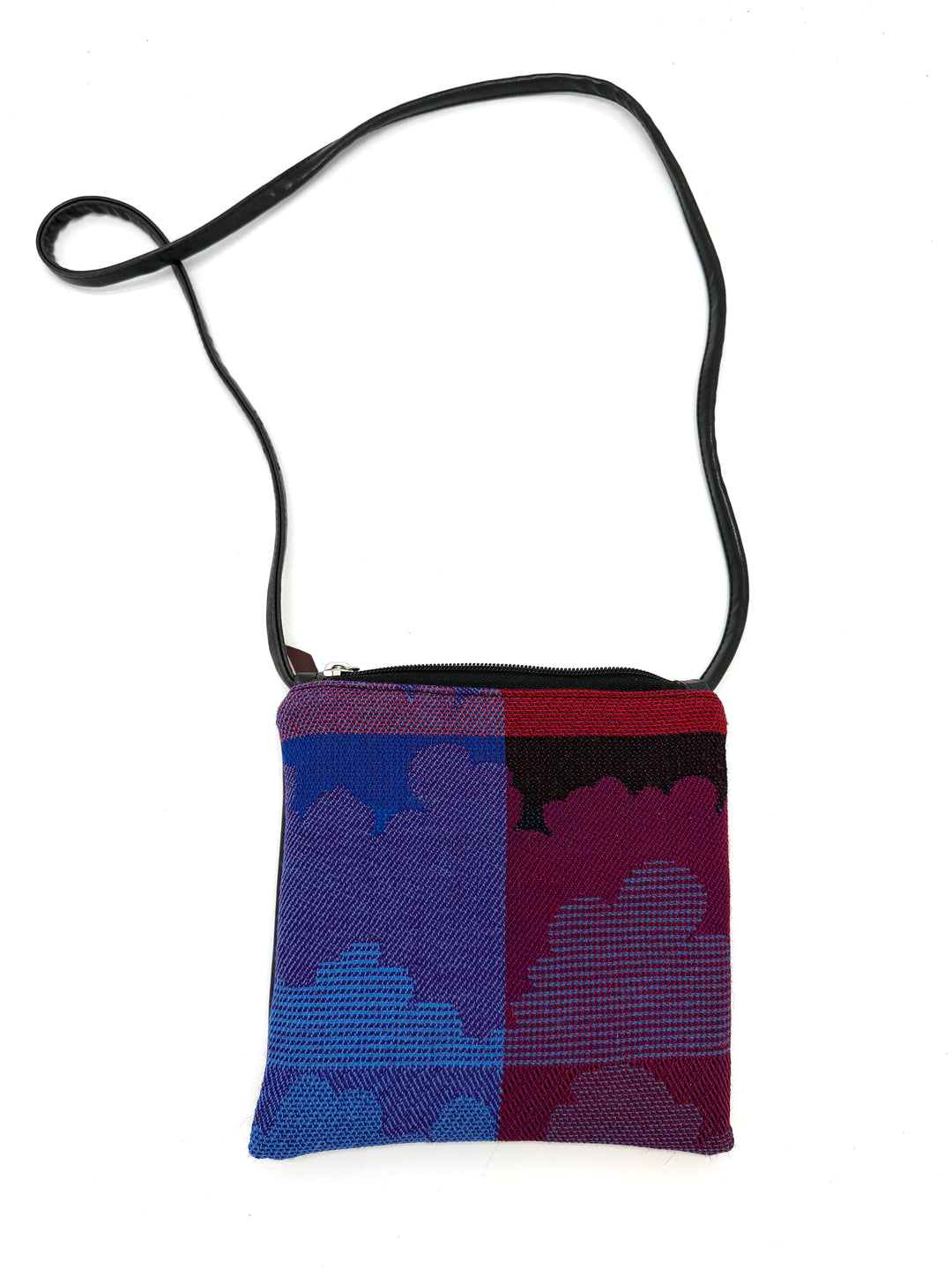 Small crossbody bag with a blue and red pattern on a white background#color_clouds-cool