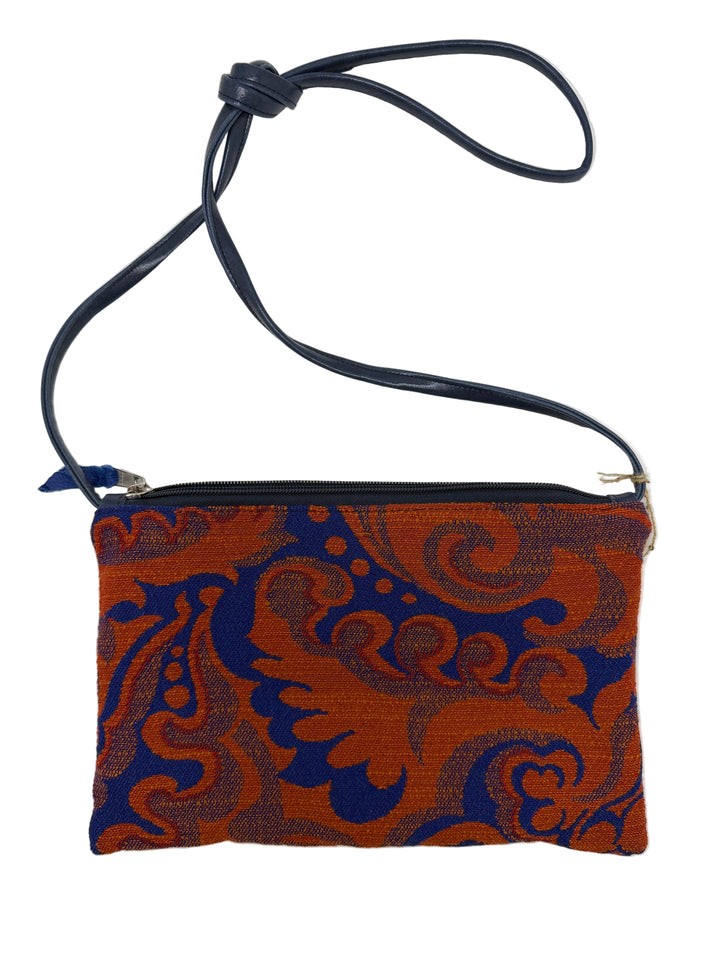 Small crossbody bag in blue and red with blue and orange pattern on a white background vintage airplane fabric#color_western-airlines-paisley-blue-orange