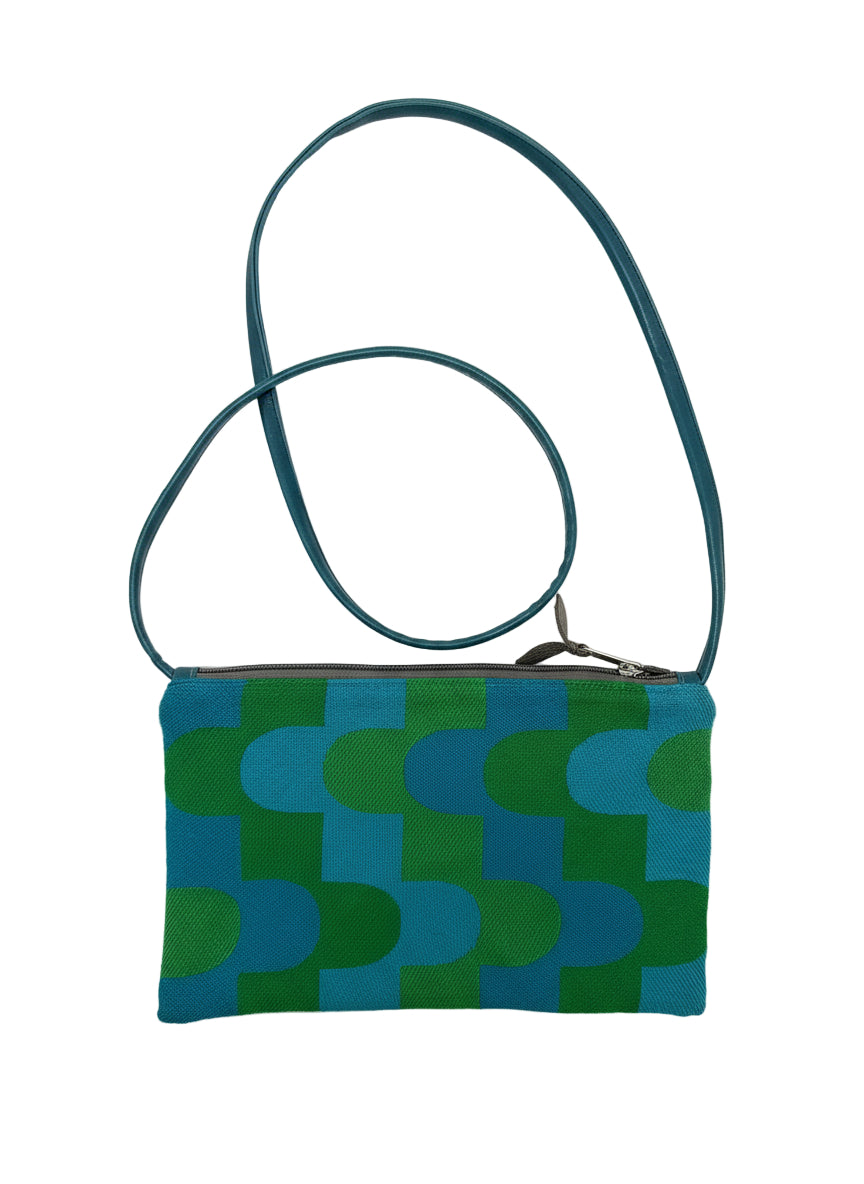 Green and blue patterned pouch with a strap on a white background#color_sky-arches-teal-green