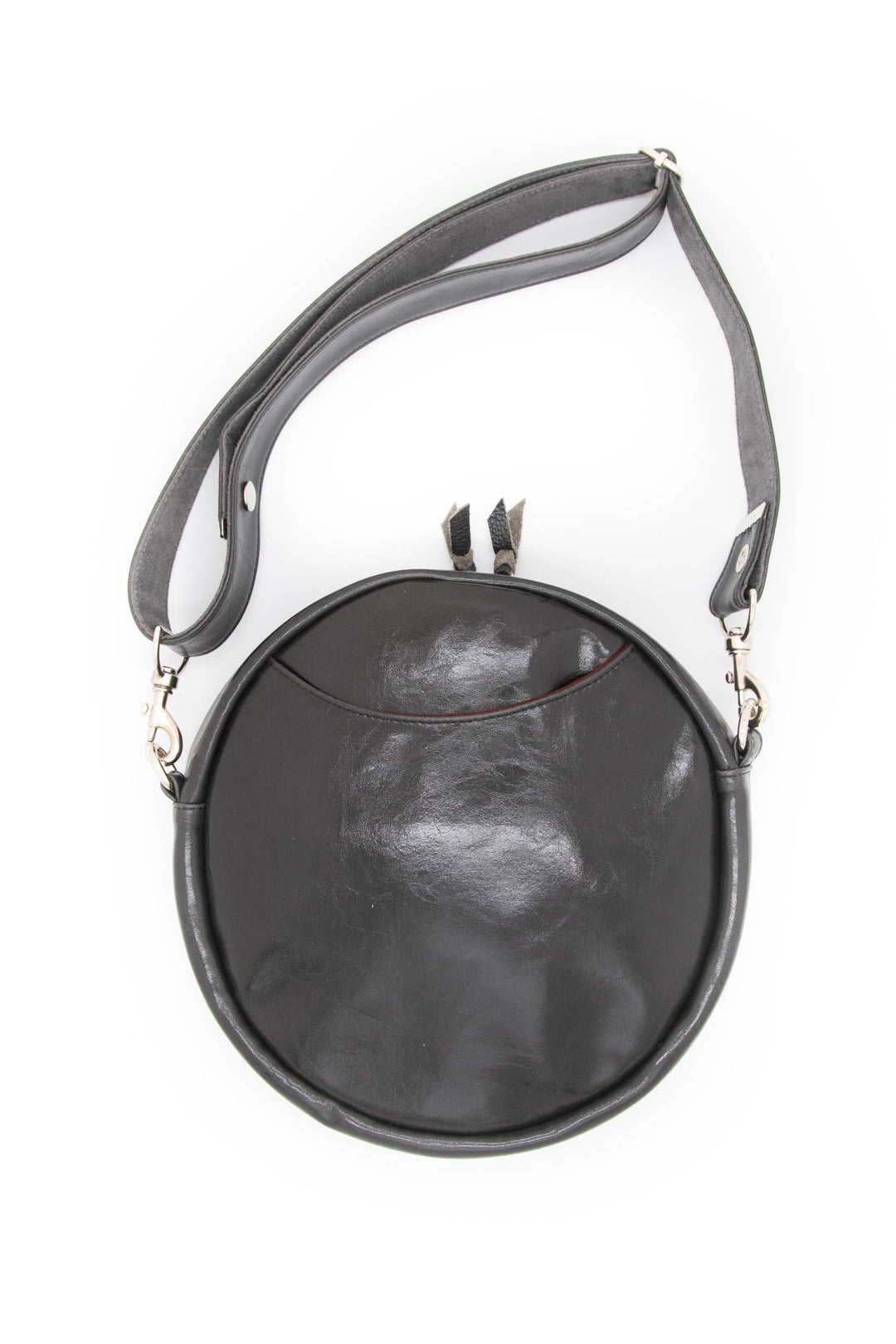 Round black handbag with a gray strap on a white background#color_midnight-garden