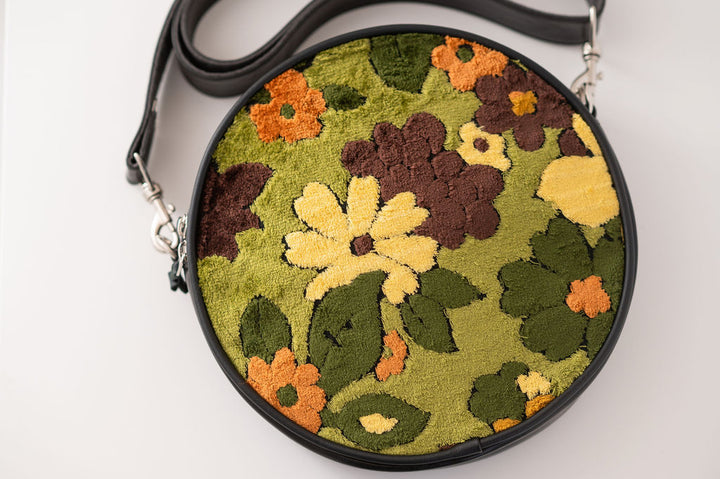 Round handbag with floral pattern on a white background#color_groovy-green-floral-chenille