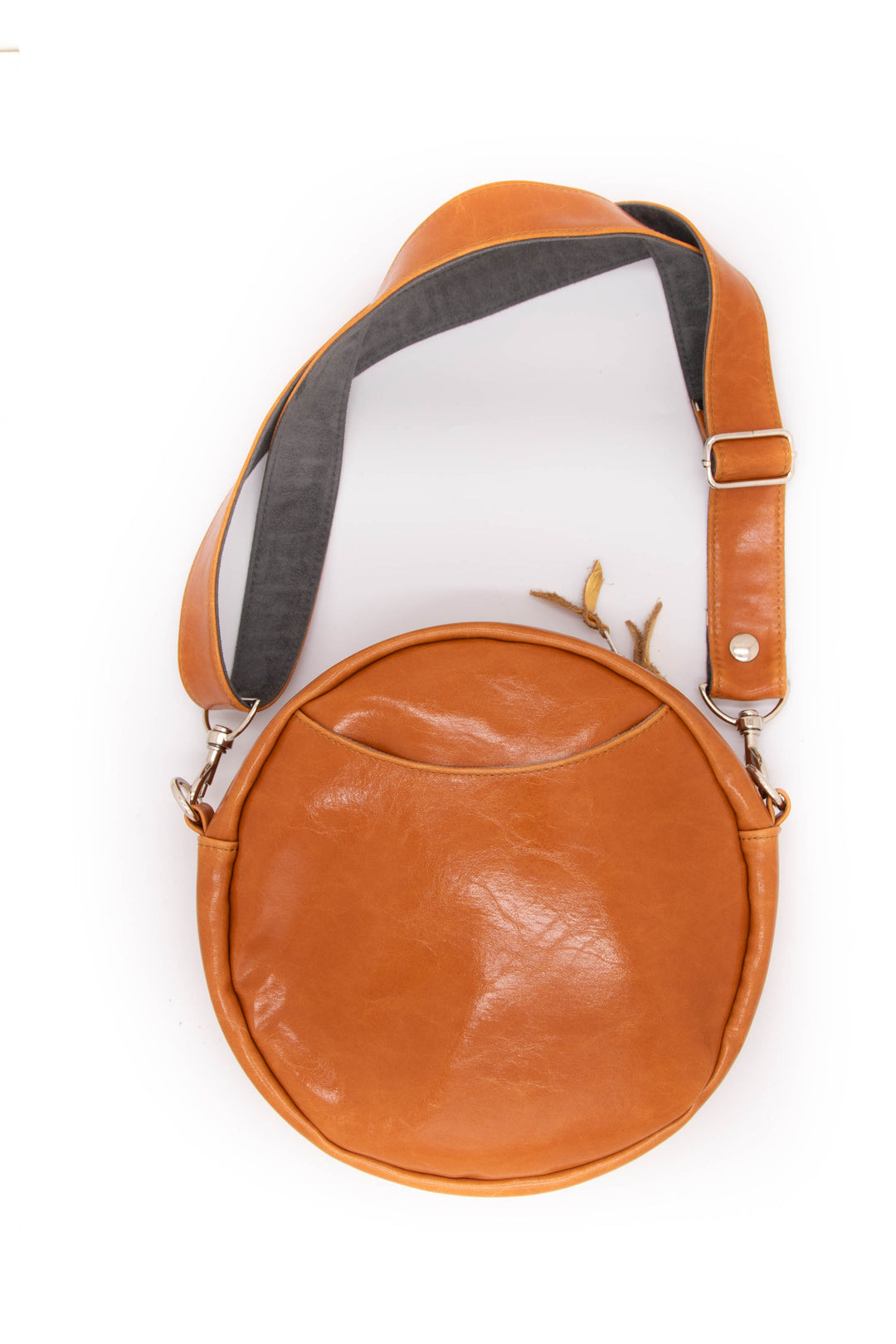 Brown leather crossbody bag on a white background#color_egypt-air-orange-gold