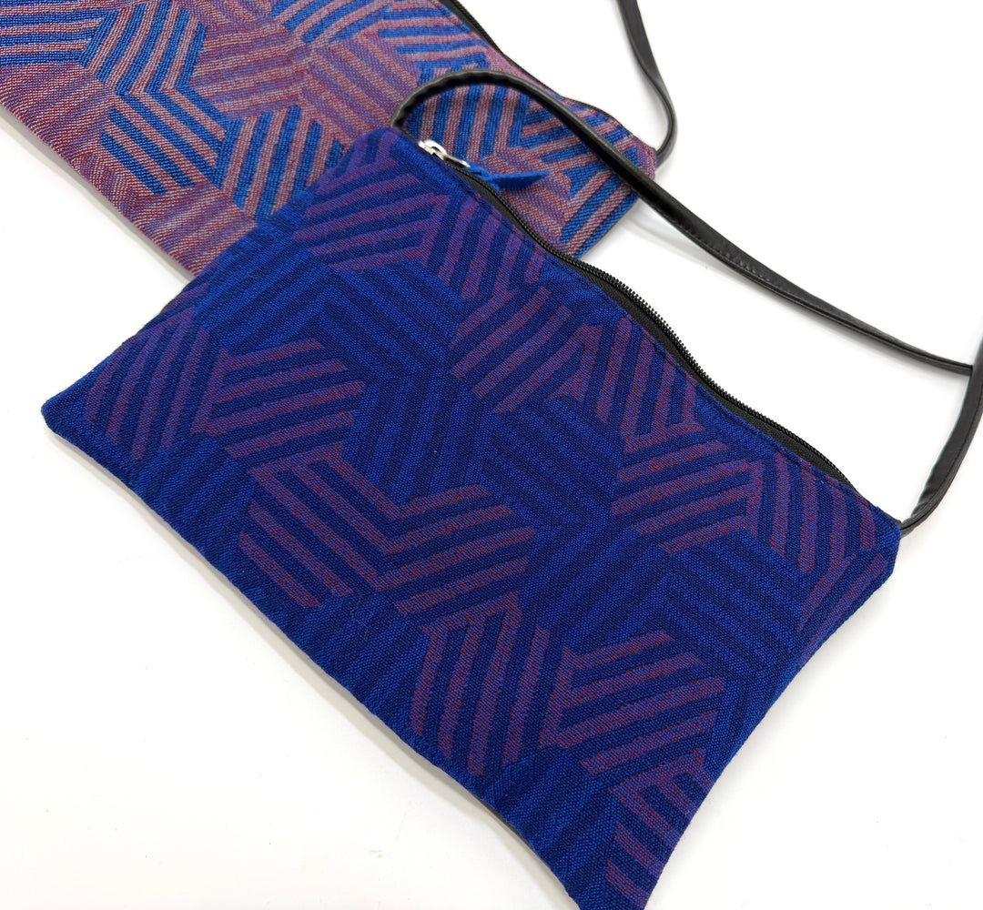 Two hexagon patterned pouches from vintage airplane fabric against a white background#color_hexagon-cool