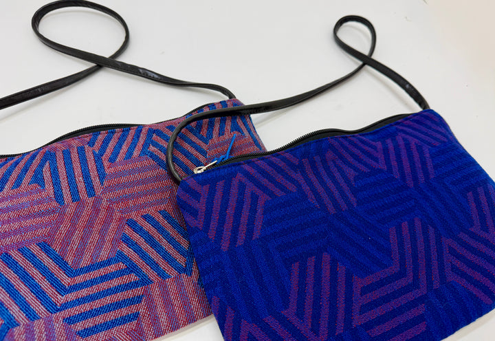 Two hexagon patterned pouches from vintage airplane fabric against a white background#color_hexagon-cool