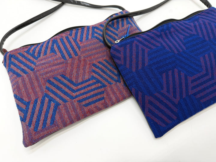 Two hexagon patterned pouches from vintage airplane fabric against a white background#color_hexagon-cool