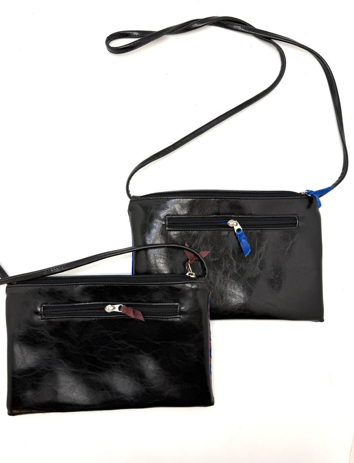 Two black leather handbags with zippers on a white background@color_hexagon-cool