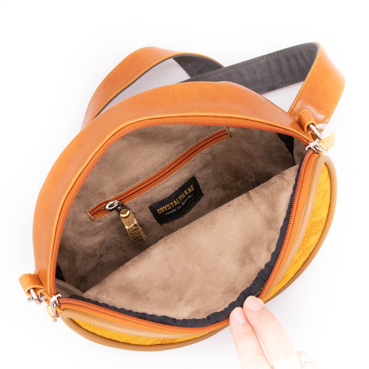 Orange bag with visible brand name on a white background#color_egypt-air-orange-gold