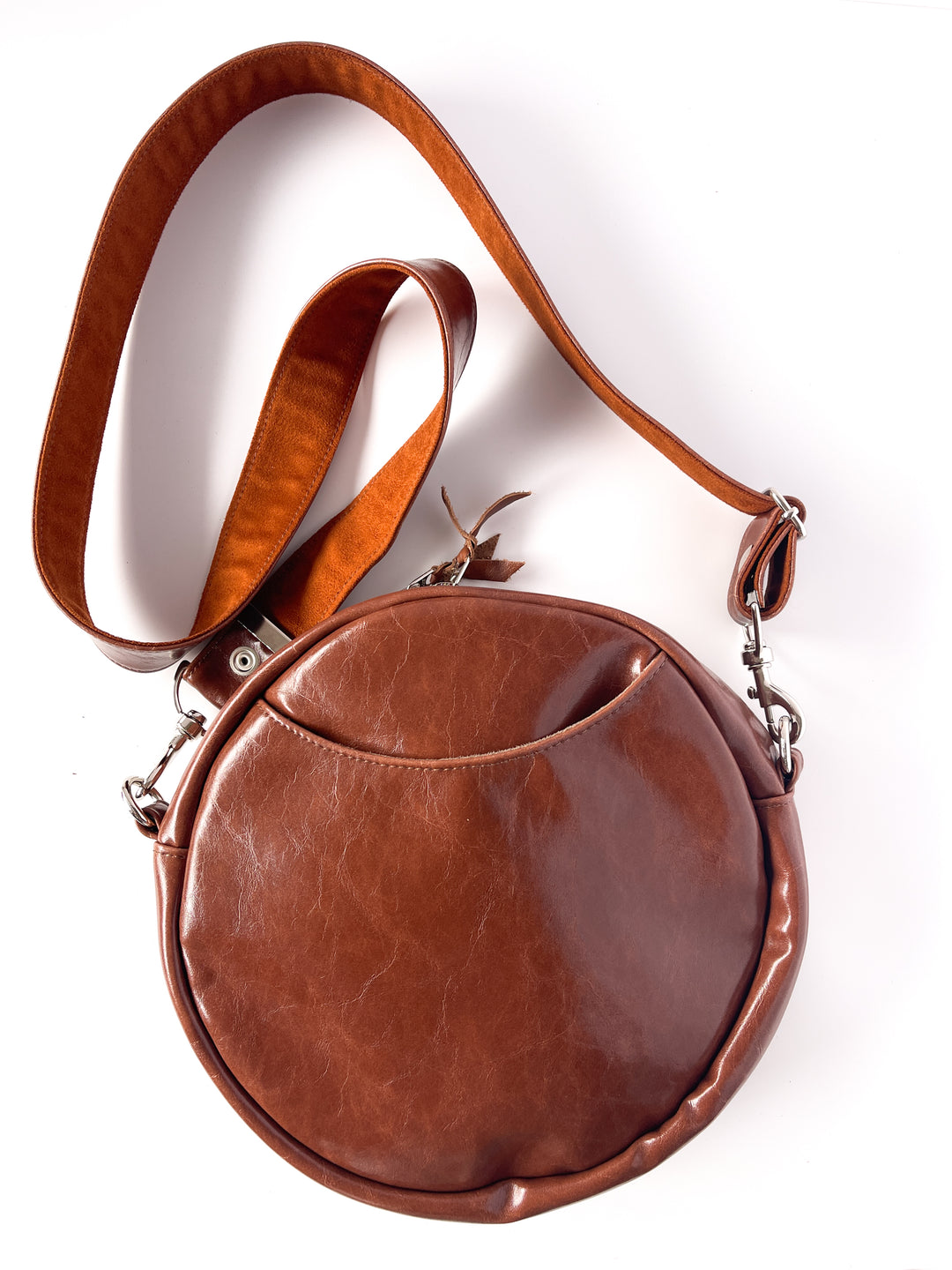 Brown leather handbag with a strap on a white background#color_bargello-needlepoint