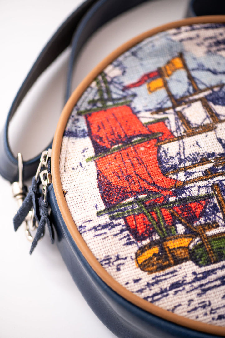 Round bag with embroidered design of a sailboat on a white background#color_nautical-sailboat-barkcloth