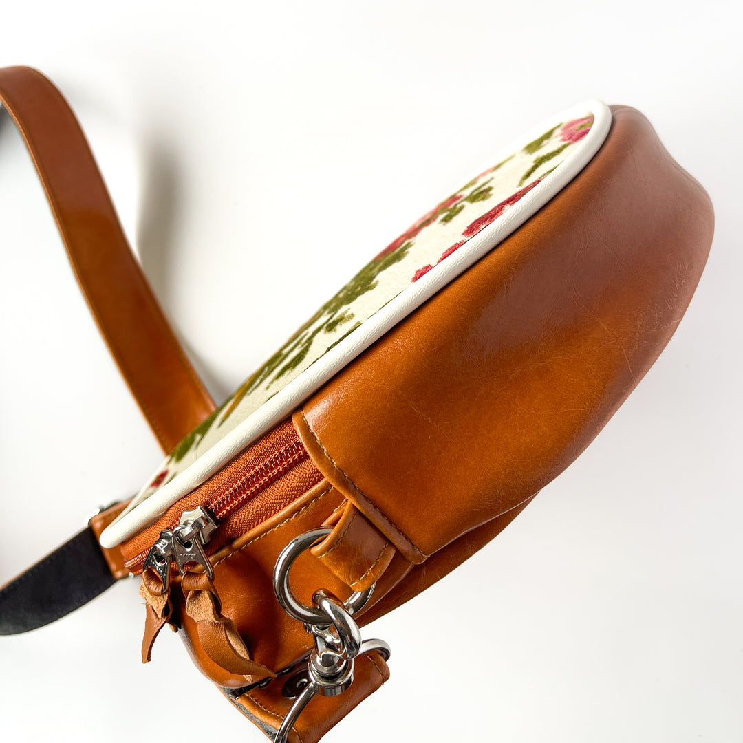 Brown leather bag with floral patterned flap on a white background#color_white-french-floral-brocade