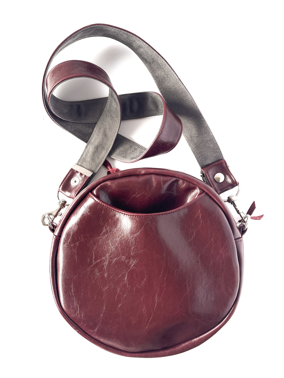 Round leather handbag with a strap on a white background#color_golden-floral-chenille