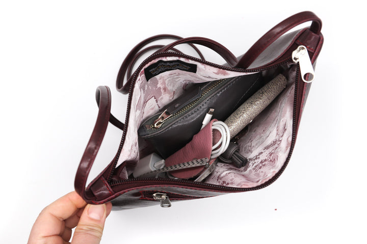 top view of lining and contents of Bossa Nova Medium Crossbody bag - Wine Vegan Coated Canvas made in USA