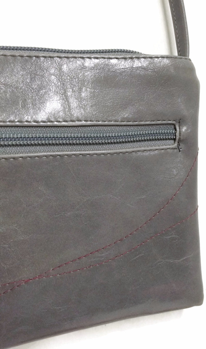 close-up detail of Cha Cha Small Crossbody Bag made in usa Grey Vegan coated canvas